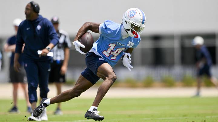 Jun 16, 2026; Nashville, TN, USA;  Tennessee Titans wider receiver Carnell Tate (14) runs with the ball during day 1 of mini-camp at Vanderbilt Health Football Center. Mandatory Credit: Steve Roberts-Imagn Images