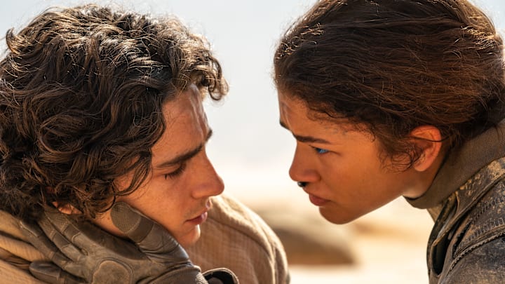 (L-r) TIMOTHÉE CHALAMET as Paul Atreides and ZENDAYA as Chani in Warner Bros. Pictures and Legendary Pictures’ action adventure “DUNE: PART TWO,” a Warner Bros. Pictures release. Photo Credit: Niko Tavernise © 2023 Warner Bros. Entertainment Inc. All Rights Reserved.