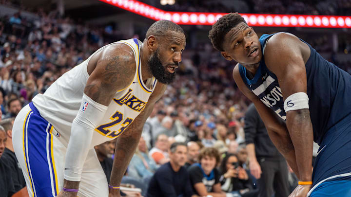 Apr 27, 2025; Minneapolis, Minnesota, USA; Minnesota Timberwolves guard Anthony Edwards (5) guards Los Angeles Lakers forward LeBron James (23) in the second quarter during game four of first round for the 2025 NBA Playoffs at Target Center.