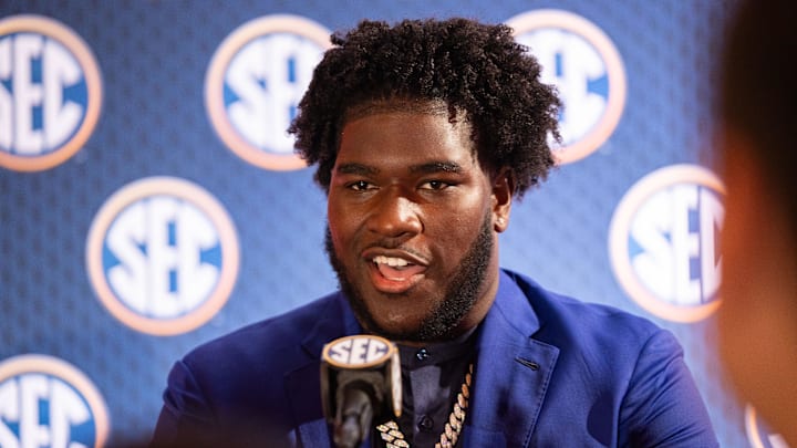 Alabama offensive lineman Tyler Booker speaking at Omni Dallas Hotel.