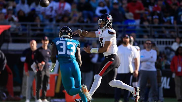 Houston Texans quarterback C.J. Stroud (7) throws the ball against Jacksonville Jaguars linebacker Devin Lloyd (33) during the third quarter of an NFL football matchup Sunday, Dec. 1, 2024 at EverBank Stadium in Jacksonville, Fla. The Texans held off the Jaguars 23-20. [Corey Perrine/Florida Times-Union]