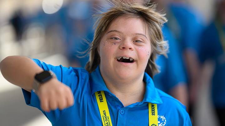 A Special Olympics athlete enters the Opening Ceremony
