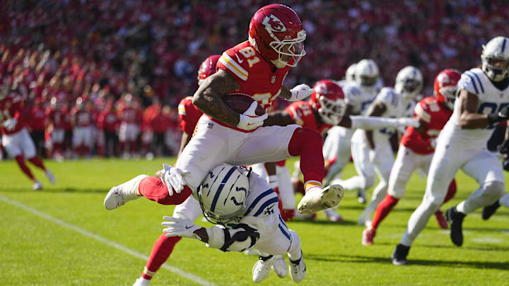 Nov 23, 2025; Kansas City, Missouri, USA; Kansas City Chiefs wide receiver Nikko Remigio (81) runs against Indianapolis Colts running back Tyler Goodson (31) in the first half at GEHA Field at Arrowhead Stadium.