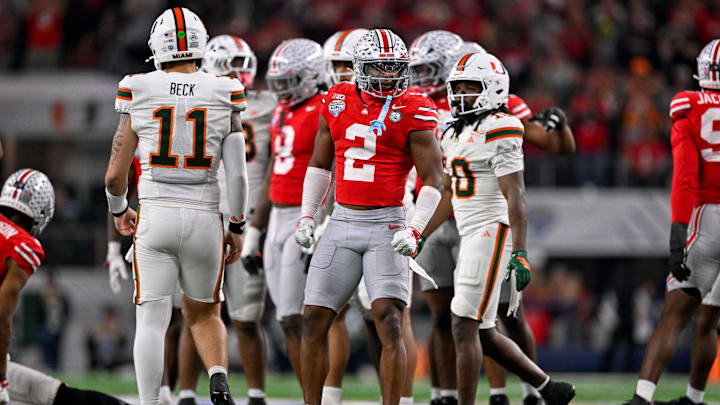 Dec 31, 2025; Arlington, TX, USA; Ohio State Buckeyes safety Caleb Downs (2) celebrates a defensive stop during the 2025 Cotton Bowl and quarterfinal game of the College Football Playoff at AT&T Stadium. Mandatory Credit: Jerome Miron-Imagn Images