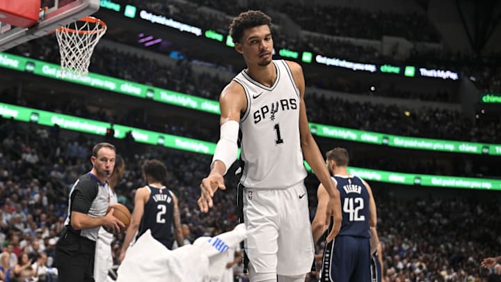 Oct 24, 2024; Dallas, Texas, USA; San Antonio Spurs center Victor Wembanyama (1) tosses a towel back to a team attendant during the second half against the Dallas Mavericks at the American Airlines Center.