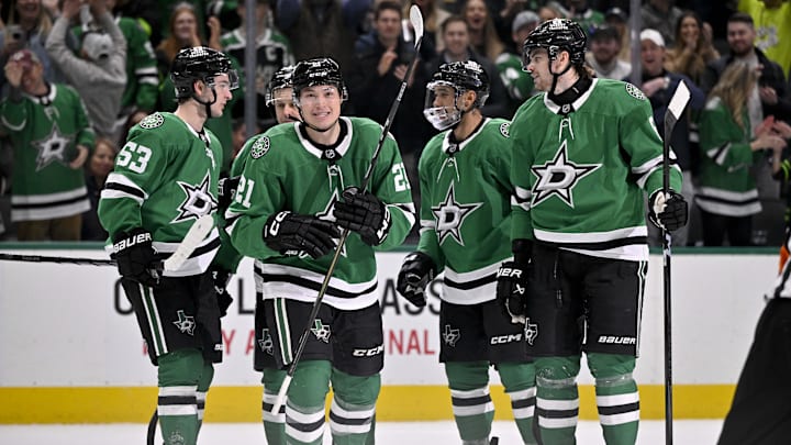 Jan 24, 2025; Dallas, Texas, USA; Dallas Stars left wing Jason Robertson (21) and right wing Evgenii Dadonov (63) and defenseman Matt Dumba (3) and defenseman Lian Bichsel (6) and center Wyatt Johnston (53) celebrates a goal scored by Robertson against the Vegas Golden Knights during the second period at the American Airlines Center. Mandatory Credit: Jerome Miron-Imagn Images
