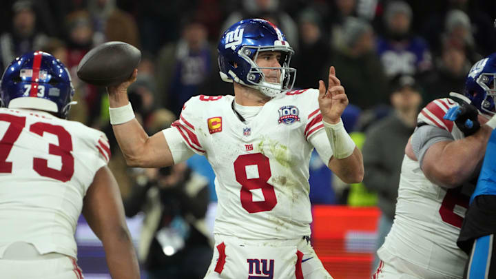 Nov 10, 2024; Munich, Germany; New York Giants quarterback Daniel Jones (8) throws the ball against the Carolina Panthers  in the second half during the 2024 NFL Munich Game at Allianz Arena. Mandatory Credit: Kirby Lee-Imagn Images