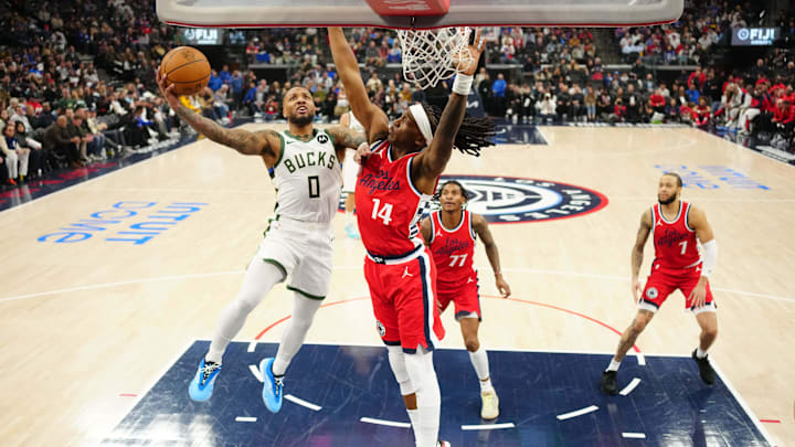 Jan 25, 2025; Inglewood, California, USA: Milwaukee Bucks guard Damian Lillard (0) shoots the ball against LA Clippers guard Terance Mann (14) in the first half at Intuit Dome. Mandatory Credit: Kirby Lee-Imagn Images Jan 25, 2025; Inglewood, California, USA: Milwaukee Bucks guard Damian Lillard (0) shoots the ball against LA Clippers guard Terance Mann (14) in the first half at Intuit Dome. Mandatory Credit: Kirby Lee-Imagn Images