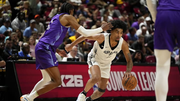 Jul 14, 2025; Las Vegas, NV, USA; San Antonio Spurs guard Dylan Harper dribbles the ball against Utah Jazz forward Cody Williams (5) during the second half of a NBA basketball game at the Thomas & Mack Center. Mandatory Credit: Lucas Peltier-Imagn Images