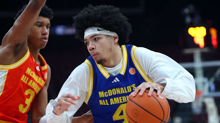 Mar 31, 2026; Glendale, AZ, USA; Tyran Stokes (4) moves the ball against Bruce Branch III (3) during the McDonalds All American Boys Game at Desert Diamond Arena. Mandatory Credit: Mark J. Rebilas-Imagn Images
