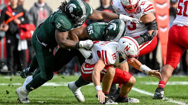 Michigan State's Simeon Barrow Jr., left, and Jalen Thompson force a fumble by Nebraska's Heinrich Haarberg during the fourth quarter on Saturday, Nov. 4, 2023, at Spartan Stadium in East Lansing.