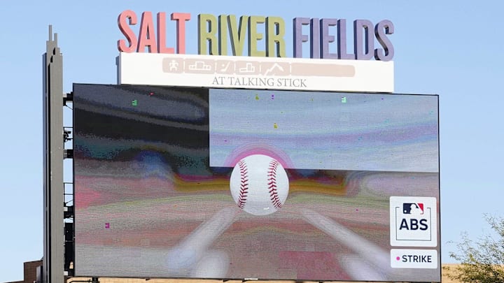 The scoreboard shows the ball touching the strike zone after Arizona Diamondbacks pitcher Corbin Burnes wins the first ABS challenge against the Colorado Rockies in his debut on opening day of spring training season at Salt River Fields at Talking Stick in Scottsdale on Feb. 21, 2025.