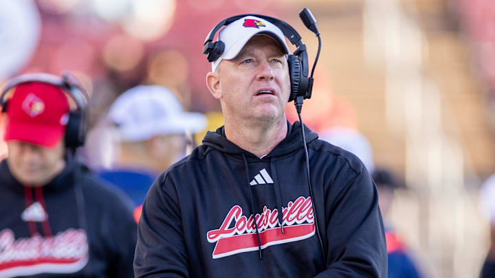 Nov 16, 2024; Stanford, California, USA; Louisville Cardinals head coach Jeff Brohm walks on the sidelines during the fourth quarter against the Stanford Cardinal at Stanford Stadium. Nov 16, 2024; Stanford, California, USA; Louisville Cardinals head coach Jeff Brohm walks on the sidelines during the fourth quarter against the Stanford Cardinal at Stanford Stadium.