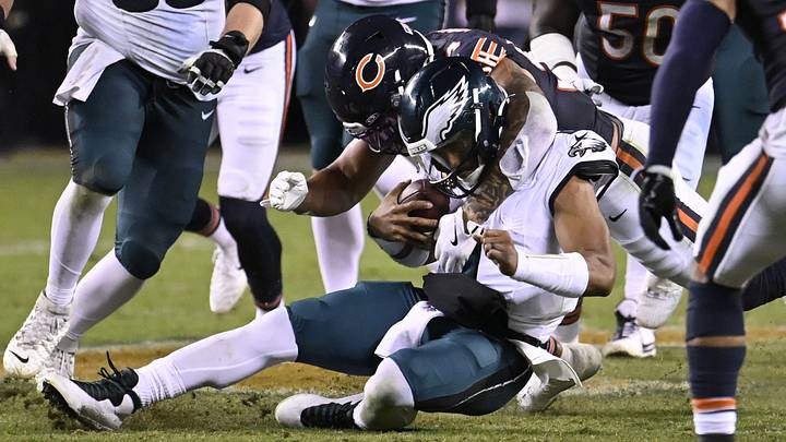Chicago Bears defensive line Austin Booker (94) tackles Philadelphia Eagles quarterback Jalen Hurts (1) during the second half at Soldier Field. Mandatory Credit: Matt Marton-Imagn Images Chicago Bears defensive line Austin Booker (94) tackles Philadelphia Eagles quarterback Jalen Hurts (1) during the second half at Soldier Field. Mandatory Credit: Matt Marton-Imagn Images