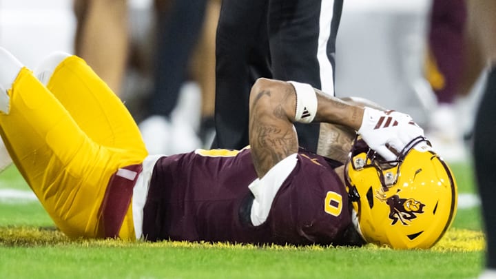Nov 28, 2025; Tempe, Arizona, USA; Arizona State Sun Devils wide receiver Jordyn Tyson (0) reacts after suffering an injury against the Arizona Wildcats in the first half during the 99th Territorial Cup at Mountain America Stadium. Mandatory Credit: Mark J. Rebilas-Imagn Images Nov 28, 2025; Tempe, Arizona, USA; Arizona State Sun Devils wide receiver Jordyn Tyson (0) reacts after suffering an injury against the Arizona Wildcats in the first half during the 99th Territorial Cup at Mountain America Stadium. Mandatory Credit: Mark J. Rebilas-Imagn Images