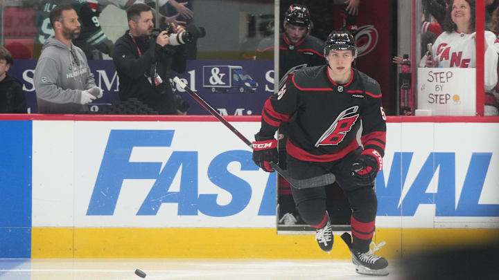 May 28, 2025; Raleigh, North Carolina, USA; Carolina Hurricanes defenseman Scott Morrow (56) enters the ice for warm up prior to the first period against the Florida Panthers in game five of the Eastern Conference Final of the 2025 Stanley Cup Playoffs at Lenovo Center. Mandatory Credit: James Guillory-Imagn Images