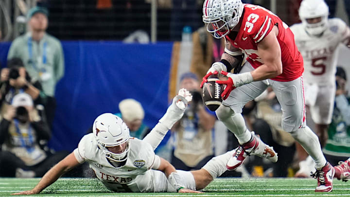 Ohio State Buckeyes defensive end Jack Sawyer sacks Texas Longhorns quarterback Quinn Ewers.