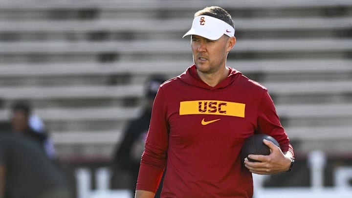 Oct 19, 2024; College Park, Maryland, USA;  Southern California Trojans head coach Lincoln Riley stands on the field before the game against the Maryland Terrapins at SECU Stadium. Mandatory Credit: Tommy Gilligan-Imagn Images