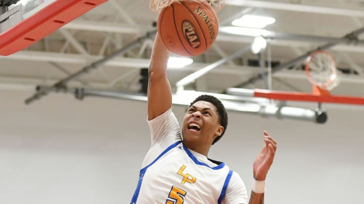 Meleek Thomas dunks the ball during Friday   s PIAA Class 4A quarterfinal game against North Catholic at Fox Chapel High School.