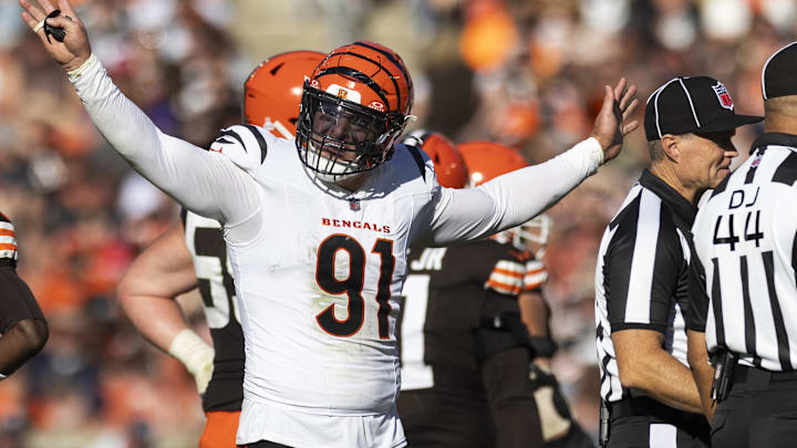 Oct 20, 2024; Cleveland, Ohio, USA; Cincinnati Bengals defensive end Trey Hendrickson (91) reacts following penalty flags being thrown during the fourth quarter against the Cleveland Browns at Huntington Bank Field. The penalties were against the Browns. Mandatory Credit: Scott Galvin-Imagn Images