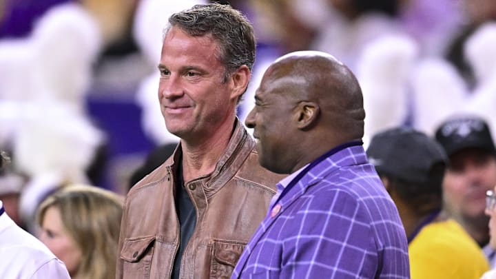 Dec 27, 2025; Houston, TX, USA; Louisiana State Tigers head coach Lane Kiffin, left, stands next to Louisiana State Tigers athletic director Verge Ausberry, right, prior to the game against the Houston Cougars at NRG Stadium. Mandatory Credit: Maria Lysaker-Imagn Images 