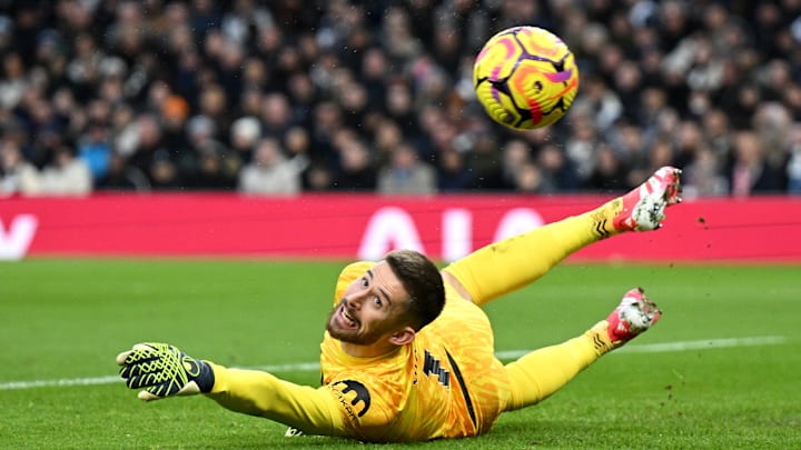 Guglielmo Vicario makes a save against Manchester United 