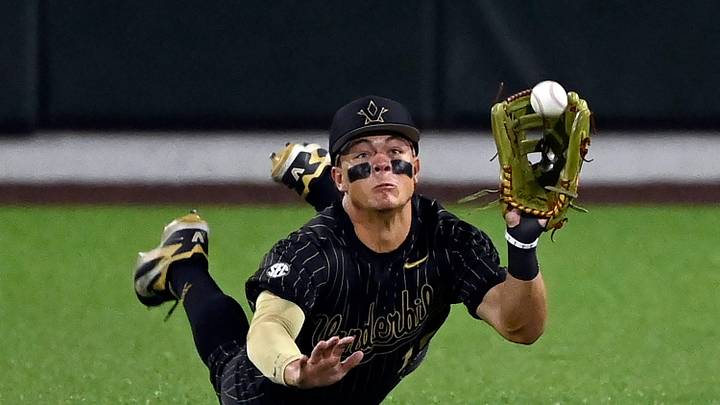 Vanderbilt center fielder Rustan Rigdon (19) makes a driving catch on a ball hit by Texas’ Ashton Larson during the seventh inning of a NCAA baseball game at Hawkins Field on Friday, April 24, 2026, in Nashville, Tenn.