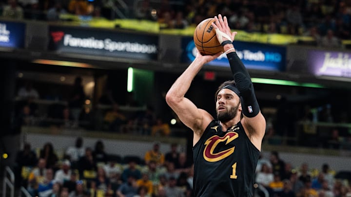 May 11, 2025; Indianapolis, Indiana, USA; Cleveland Cavaliers guard Max Strus (1) shoots the ball while Indiana Pacers guard Tyrese Haliburton (0) defends during game four of the second round for the 2025 NBA Playoffs at Gainbridge Fieldhouse. Mandatory Credit: Trevor Ruszkowski-Imagn Images