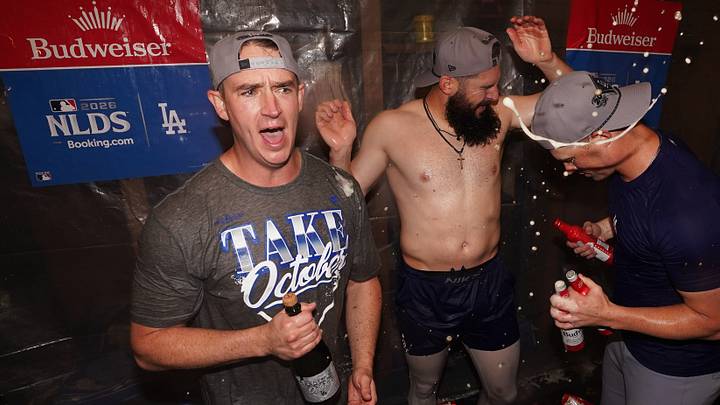 Oct 7, 2026; Cumberland, Georgia, USA;  Los Angeles Dodgers pitcher Evan Phillips (59) and pitcher Alex Vesia (51) celebrate in the locker room after defeating the Atlanta Braves in game four of the NLDS for the 2026 MLB Playoffs at Truist Park.  Mandatory Credit: Dale Zanine-Imagn Images