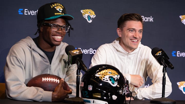 Apr 25, 2025; Jacksonville, FL, USA; Jacksonville Jaguars first round draft pick Travis Hunter talks to the media beside and general manager James Gladstone during a press conference at Miller Electric Center. Mandatory Credit: Travis Register-Imagn Images