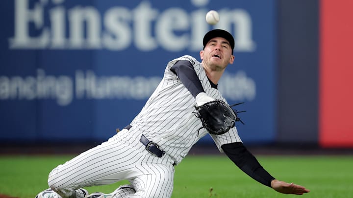 Oct 8, 2025; Bronx, New York, USA; New York Yankees left fielder Cody Bellinger (35) makes a sliding catch on a pop up by Toronto Blue Jays center fielder Daulton Varsho (not pictured) during the first inning of game four of the ALDS round of the 2025 MLB playoffs at Yankee Stadium. Mandatory Credit: Brad Penner-Imagn Images