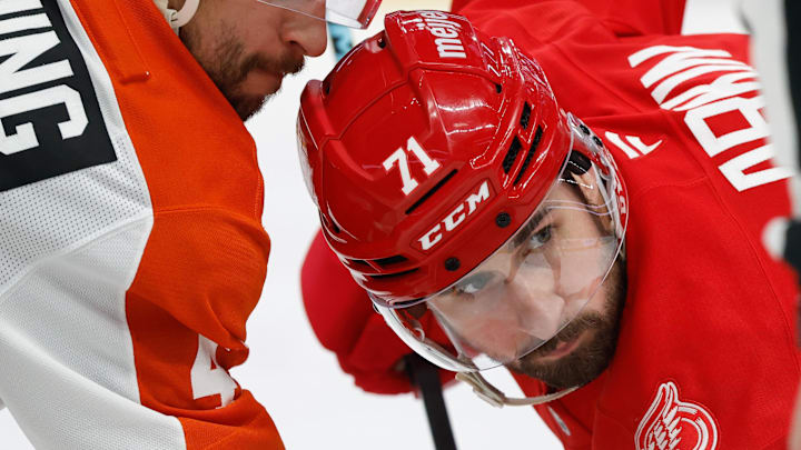 Mar 28, 2026; Detroit, Michigan, USA;  Philadelphia Flyers center Luke Glendening (41) and Detroit Red Wings center Dylan Larkin (71) gets set to face off in the second period at Little Caesars Arena. Mandatory Credit: Rick Osentoski-Imagn Images