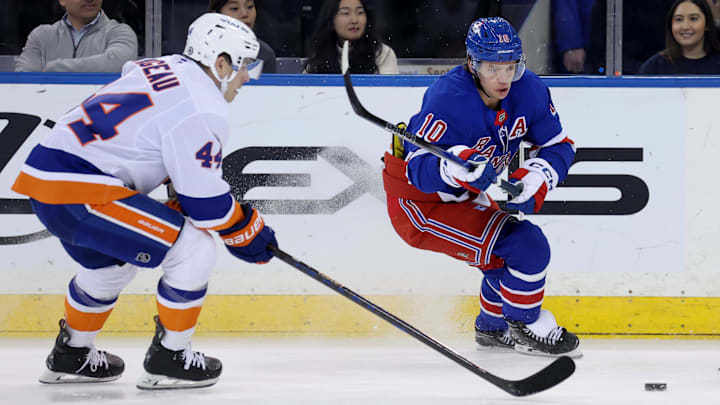 Mar 3, 2025; New York, New York, USA; New York Rangers left wing Artemi Panarin (10) fights for the puck against New York Islanders center Jean-Gabriel Pageau (44) during the first period at Madison Square Garden. Mandatory Credit: Brad Penner-Imagn Images Mar 3, 2025; New York, New York, USA; New York Rangers left wing Artemi Panarin (10) fights for the puck against New York Islanders center Jean-Gabriel Pageau (44) during the first period at Madison Square Garden. Mandatory Credit: Brad Penner-Imagn Images