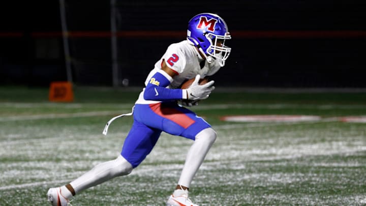Monroe’s Messiah Amare Hampton returns a kickoff against Canandaigua.