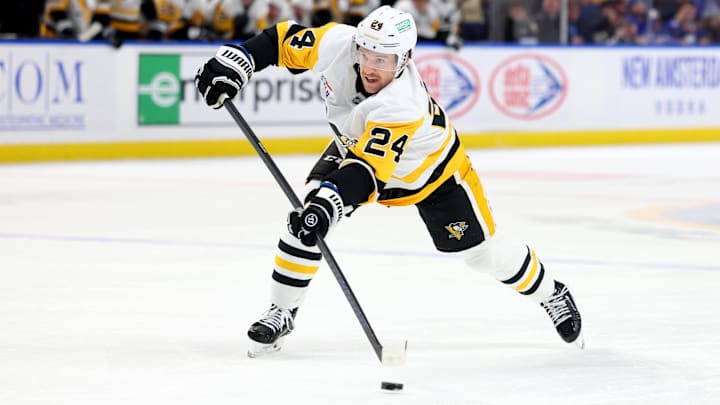 Jan 17, 2025; Buffalo, New York, USA;  Pittsburgh Penguins defenseman Matt Grzelcyk (24) makes a pass during the first period against the Buffalo Sabres at KeyBank Center. Mandatory Credit: Timothy T. Ludwig-Imagn Images