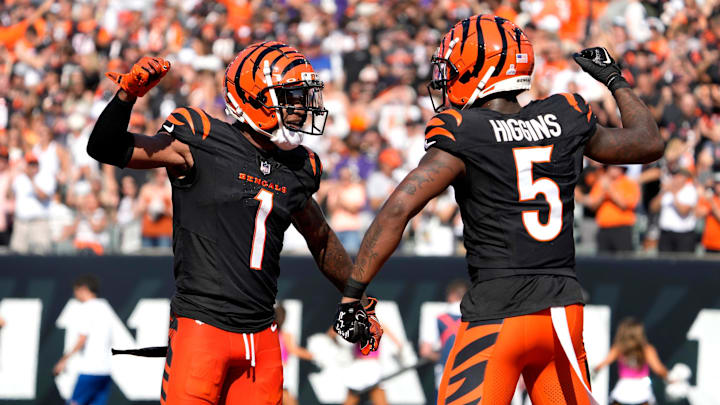 Cincinnati Bengals wide receiver Ja'Marr Chase (1) and wide receiver Tee Higgins (5) celebrate Higgins touchdown in the 3rd quarter over the Baltimore Ravens on Sunday, October 6, 2024, at Payor Stadium.