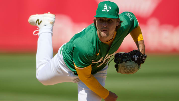 Aug 24, 2024; Oakland, California, USA; Oakland Athletics pitcher J.T. Ginn (70) throws a pitch against the Milwaukee Brewers during the eighth inning at Oakland-Alameda County Coliseum. Mandatory Credit: Robert Edwards-Imagn Images