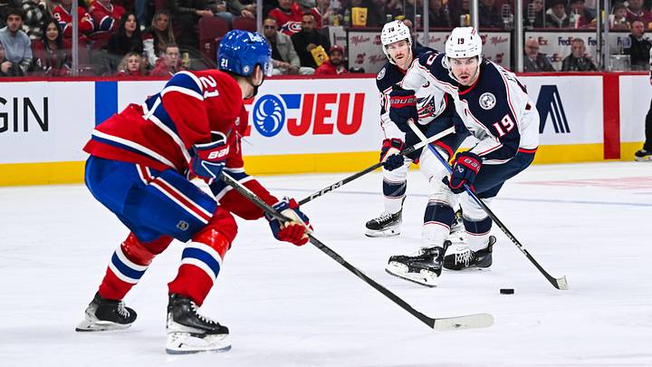 Nov 16, 2024; Montreal, Quebec, CAN; Columbus Blue Jackets center Adam Fantilli (19) plays the puck against Montreal Canadiens defenseman Kaiden Guhle (21) during the third period at Bell Centre. Mandatory Credit: David Kirouac-Imagn Images Nov 16, 2024; Montreal, Quebec, CAN; Columbus Blue Jackets center Adam Fantilli (19) plays the puck against Montreal Canadiens defenseman Kaiden Guhle (21) during the third period at Bell Centre. Mandatory Credit: David Kirouac-Imagn Images