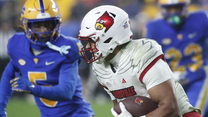 Oct 14, 2023; Pittsburgh, Pennsylvania, USA; Louisville Cardinals running back Isaac Guerendo (23) carries the ball against the Pittsburgh Panthers during the fourth quarter at Acrisure Stadium. Pittsburgh won 38-21.