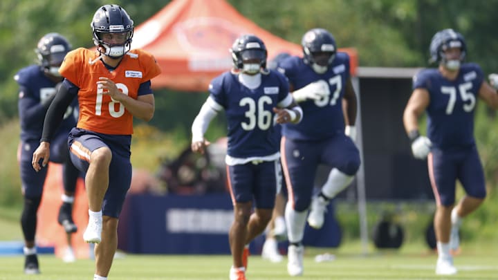 Caleb Williams and the Bears go through warmups before practicing against the Bills Friday at Halas Hall.