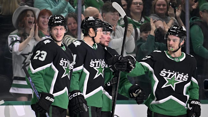 Mar 12, 2026; Dallas, Texas, USA; Dallas Stars defenseman Esa Lindell (23) and left wing Jason Robertson (21) and defenseman Miro Heiskanen (4) and center Wyatt Johnston (53) celebrates a goal scored by Robertson against the Edmonton Oilers during the first period at the American Airlines Center. Mandatory Credit: Jerome Miron-Imagn Images