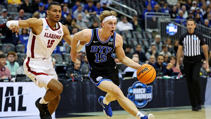 Mar 27, 2025; Newark, NJ, USA; Brigham Young Cougars forward Richie Saunders (15) drives to the basket against Alabama Crimson Tide forward Jarin Stevenson (15) during the first half during an East Regional semifinal of the 2025 NCAA tournament at Prudential Center. Mandatory Credit: Vincent Carchietta-Imagn Images