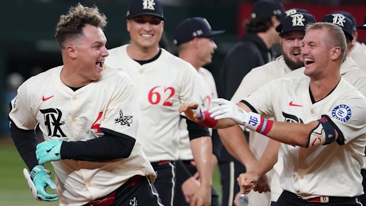 Texas Rangers first baseman Joc Pederson (4) celebrates his walk off ninth inning RBI double with third baseman Josh Jung (6) during a game against the Cleveland Guardians at Globe Life Field. Texas Rangers first baseman Joc Pederson (4) celebrates his walk off ninth inning RBI double with third baseman Josh Jung (6) during a game against the Cleveland Guardians at Globe Life Field.