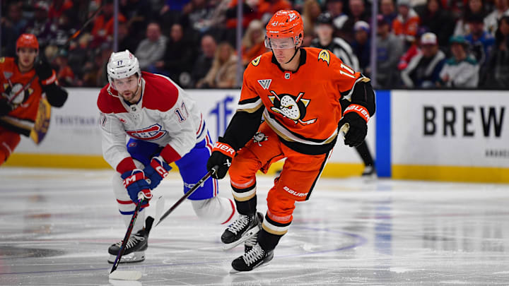 Feb 2, 2025; Anaheim, California, USA; Anaheim Ducks center Trevor Zegras (11) moves in for the puck against Montreal Canadiens right wing Josh Anderson (17) during the second period at Honda Center. Mandatory Credit: Gary A. Vasquez-Imagn Images
