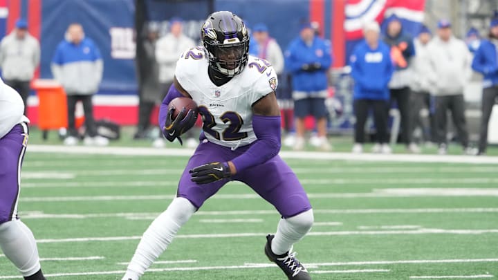 Dec 15, 2024; East Rutherford, New Jersey, USA; Baltimore Ravens running back Derrick Henry (22) runs against the New York Giants during the first half at MetLife Stadium. Mandatory Credit: Robert Deutsch-Imagn Images