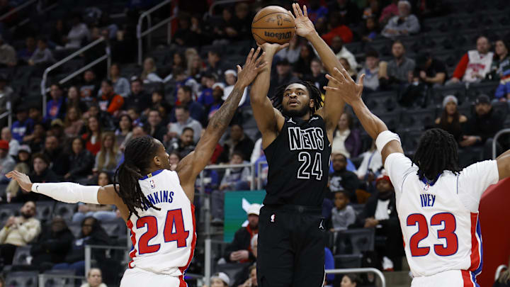 Feb 1, 2026; Detroit, Michigan, USA;  Brooklyn Nets guard Cam Thomas (24) shoots on Detroit Pistons guard Daniss Jenkins (24) and guard Jaden Ivey (23) in the first half at Little Caesars Arena. Mandatory Credit: Rick Osentoski-Imagn Images