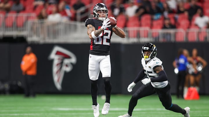Aug 23, 2024; Atlanta, Georgia, USA; Atlanta Falcons wide receiver Casey Washington (82) catches a pass in front of Jacksonville Jaguars cornerback Ronald Darby (25) in the first quarter at Mercedes-Benz Stadium.