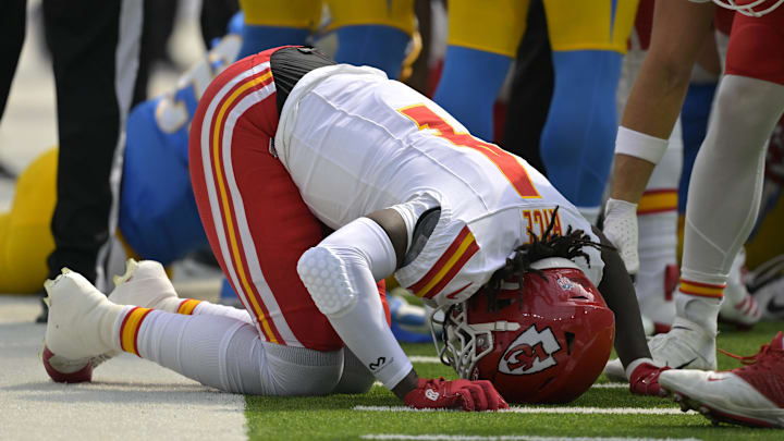 Sep 29, 2024; Inglewood, California, USA; Kansas City Chiefs wide receiver Rashee Rice (4) pounds his fist on the ground after an injury in the first half against the Los Angeles Chargers at SoFi Stadium. Mandatory Credit: Jayne Kamin-Oncea-Imagn Images Sep 29, 2024; Inglewood, California, USA; Kansas City Chiefs wide receiver Rashee Rice (4) pounds his fist on the ground after an injury in the first half against the Los Angeles Chargers at SoFi Stadium. Mandatory Credit: Jayne Kamin-Oncea-Imagn Images