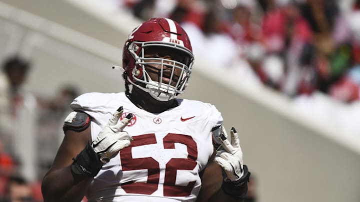 Apr 13, 2024; Tuscaloosa, AL, USA; Alabama offensive lineman Tyler Booker (52) celebrates after the offense scored a touchdown during the A-Day scrimmage at Bryant-Denny Stadium. Mandatory Credit: Gary Cosby Jr.-Imagn Images Apr 13, 2024; Tuscaloosa, AL, USA; Alabama offensive lineman Tyler Booker (52) celebrates after the offense scored a touchdown during the A-Day scrimmage at Bryant-Denny Stadium. Mandatory Credit: Gary Cosby Jr.-Imagn Images