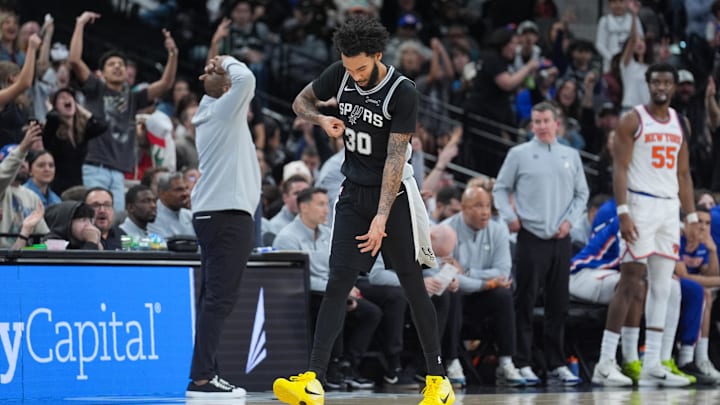 Dec 31, 2025; San Antonio, Texas, USA;  San Antonio Spurs forward Julian Champagnie (30) celebrates in the second half against the New York Knicks at Frost Bank Center. Mandatory Credit: Daniel Dunn-Imagn Images